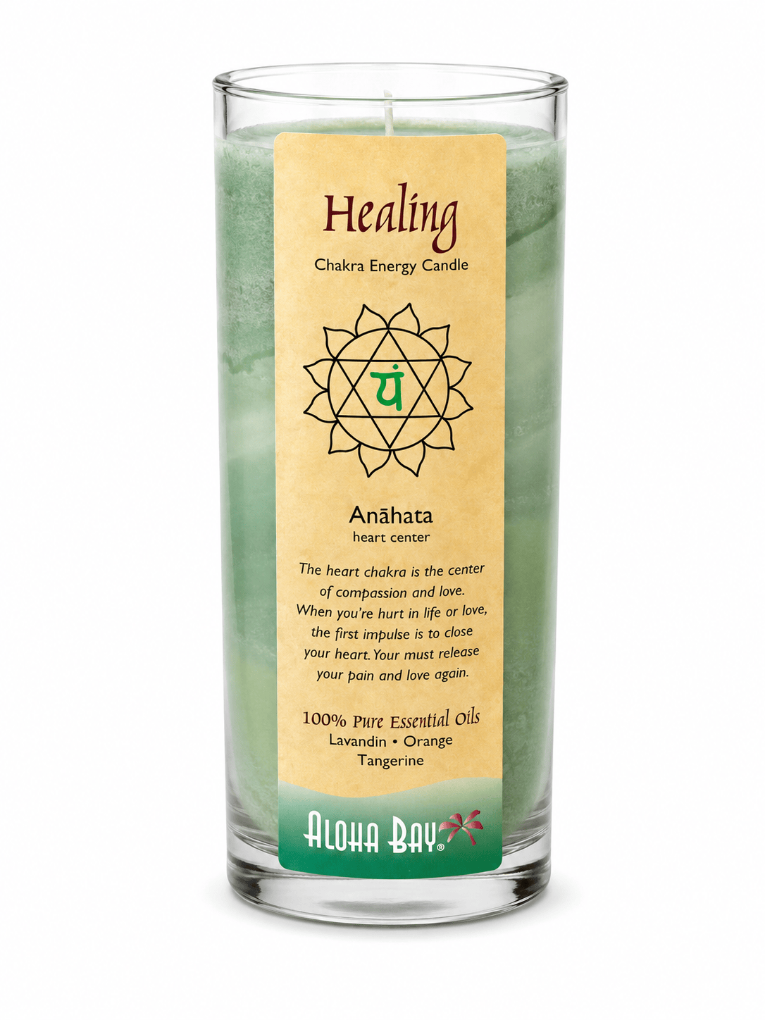 Sacred Light Soundbaths and Crystals Aloha Bay Healing Candle in a decorative glass holder with a burning flame.