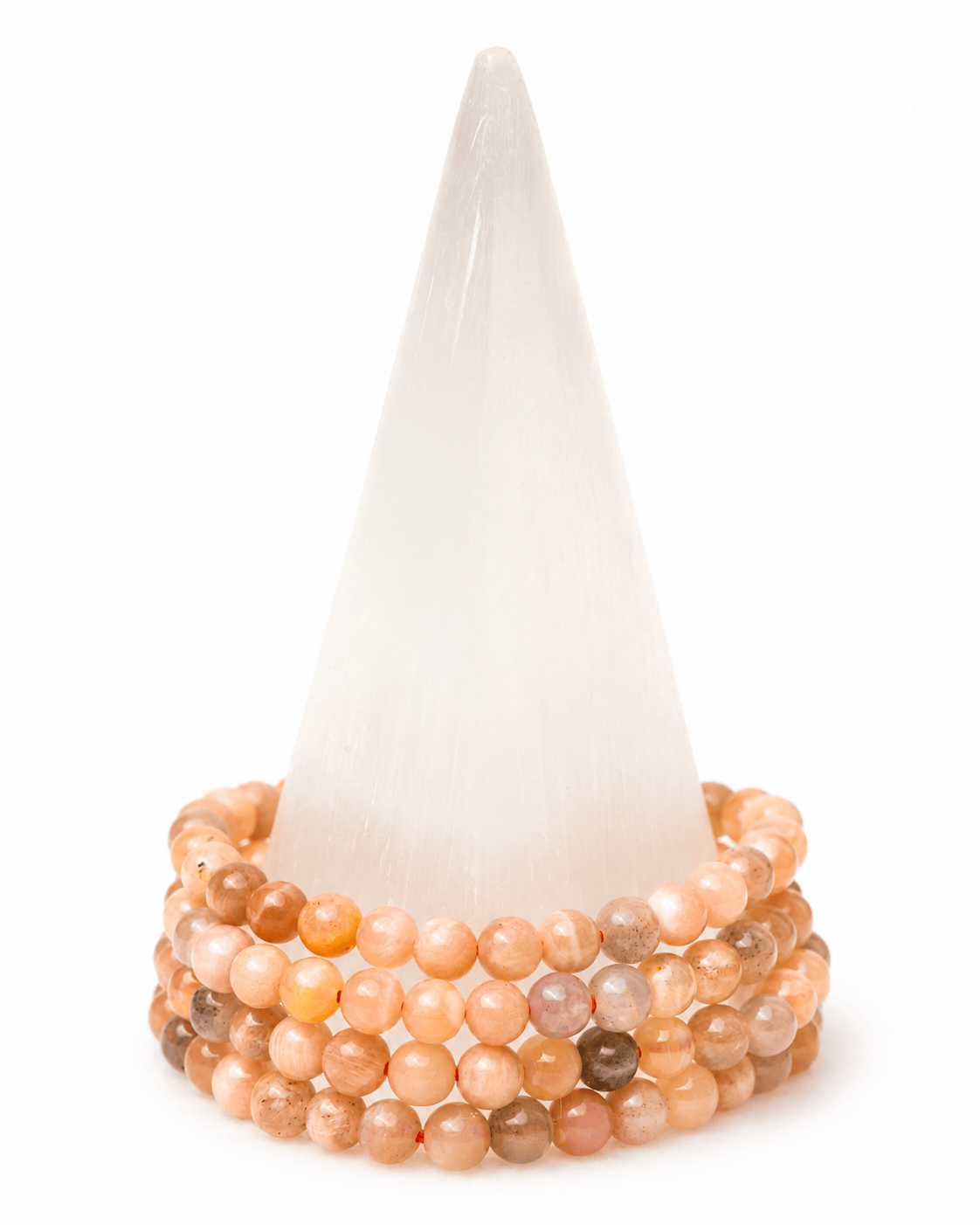 Peach moonstone beaded bracelet by Milk and Honey featuring smooth, round peach-colored moonstones on an elastic band.