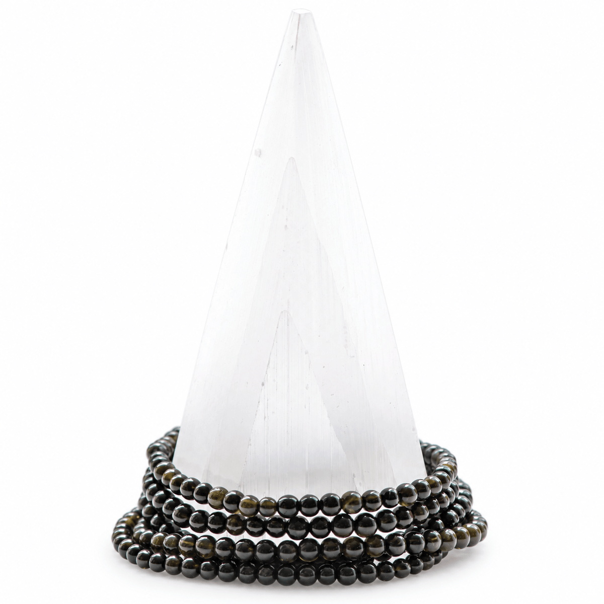Dainty black tourmaline bracelet by Milk and Honey featuring smooth, polished black stones on a delicate jewelry band.