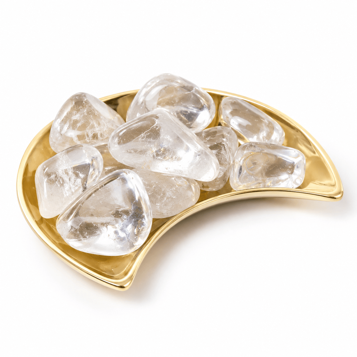 Polished tumbled clear quartz crystal from Sacred Light Soundbaths and Crystals on a white background.