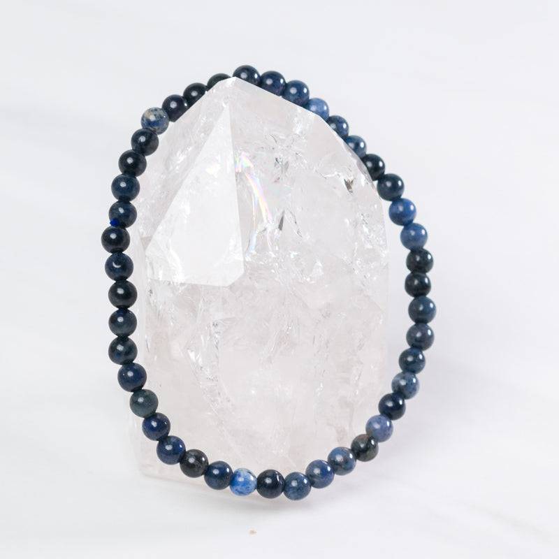 Dumortierite dainty bracelet with polished blue beads and silver accents, crafted by Milk and Honey jewelry.