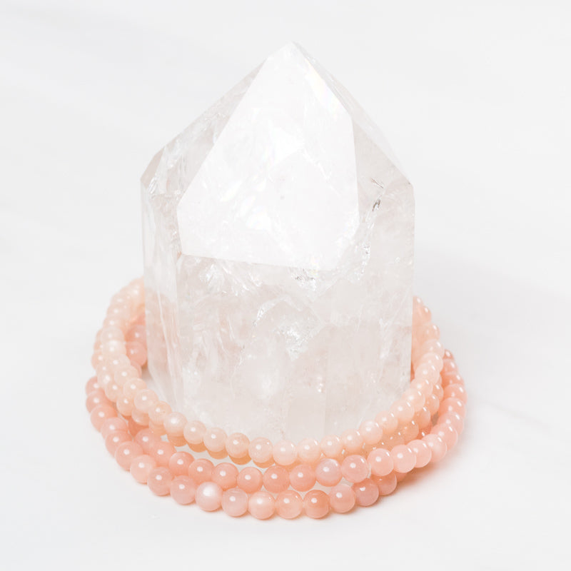 Peach moonstone dainty bracelet by Milk and Honey featuring smooth, polished beads on a delicate chain.