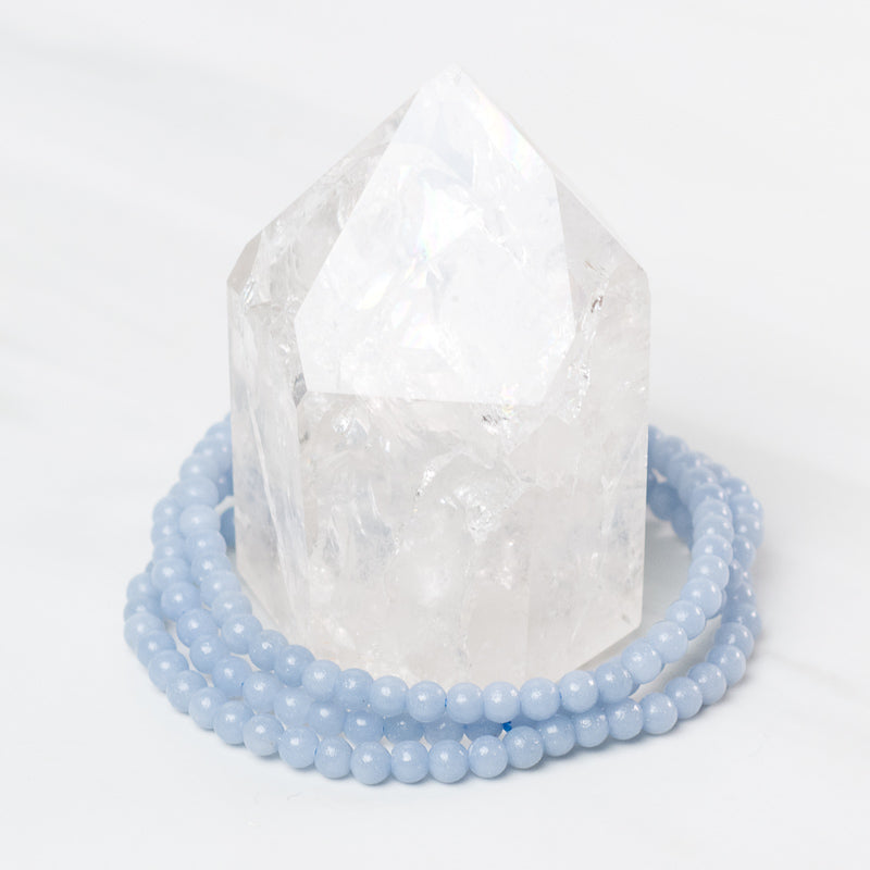 Delicate Angelite bracelet by Milk and Honey featuring smooth blue gemstone beads on a fine jewelry chain.