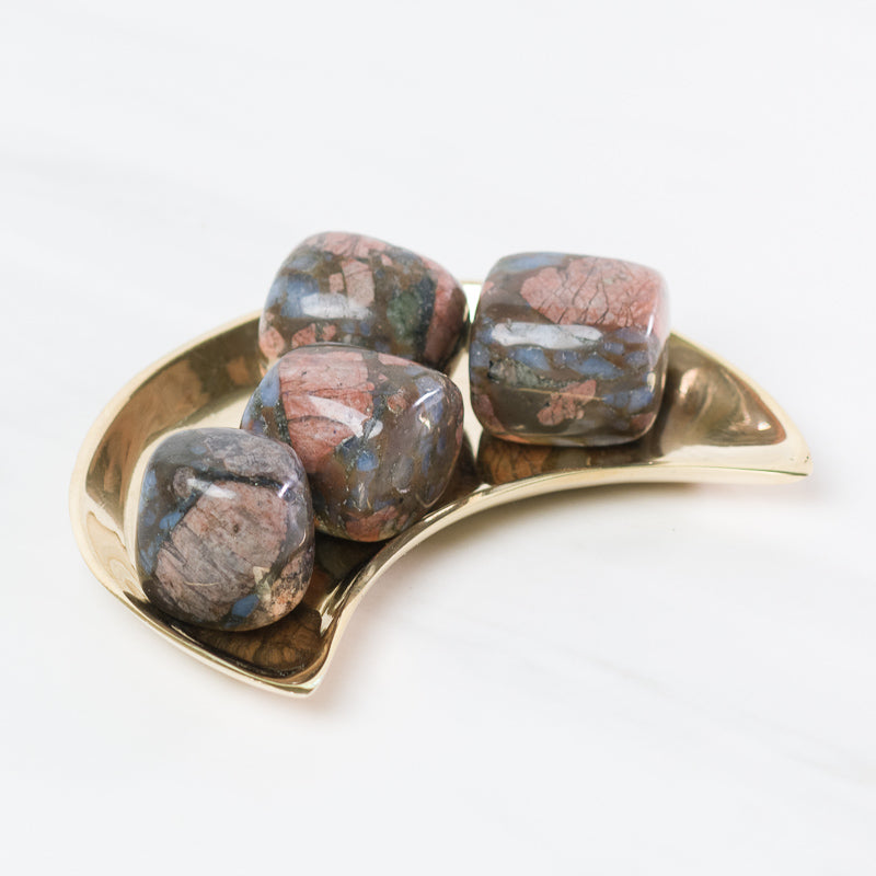 Sacred Light Soundbaths and Crystals Que Sera stones, polished gemstone with unique patterns and vibrant colors, for spiritual healing.