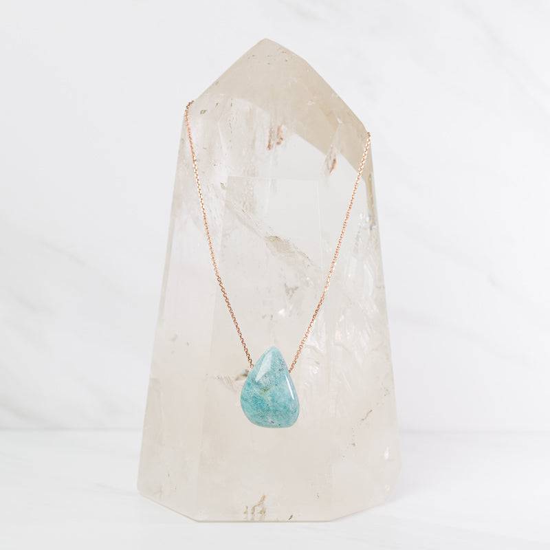 Amazonite teardrop necklace from Sacred Light Soundbaths and Crystals, featuring a polished blue-green gemstone pendant on a delicate chain.