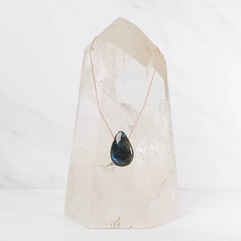 Labradorite teardrop necklace from Sacred Light Soundbaths and Crystals, showcasing a polished labradorite pendant on a silver chain.