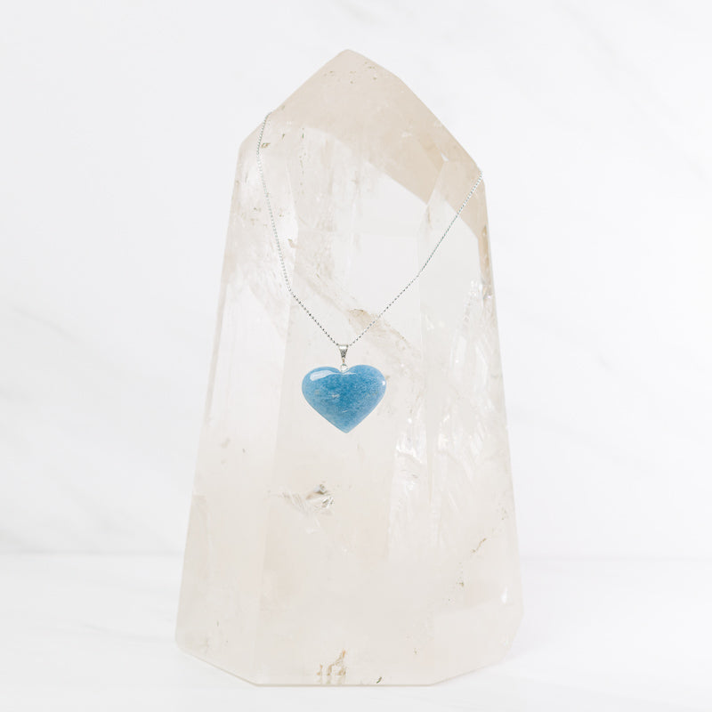 Trolleite heart pendant necklace on sterling silver chain, jewelry by Sacred Light Soundbaths and Crystals, close-up view.