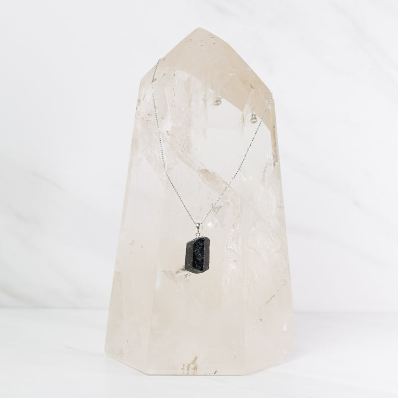 Natural black tourmaline pendant on sterling silver chain, crafted jewelry by Sacred Light Soundbaths and Crystals.