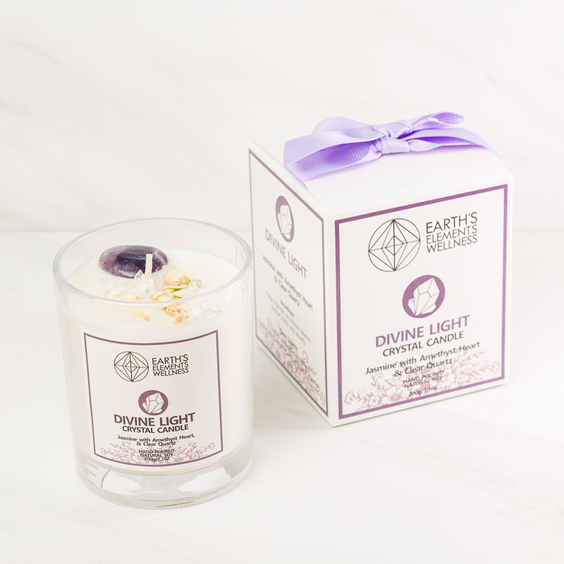 Sacred Light Soundbaths and Crystals Divine Light Aromatherapy Candle burning with a soft glow in a serene setting