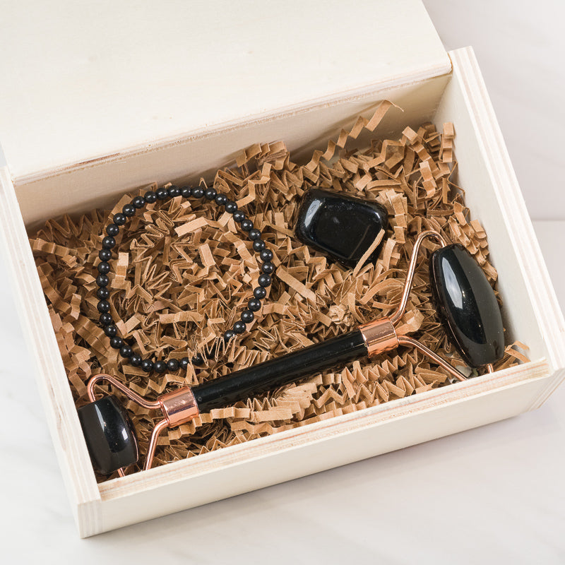 Black Obsidian face massage roller set with soothing accessories from Sacred Light Soundbaths and Crystals, designed for facial skincare.