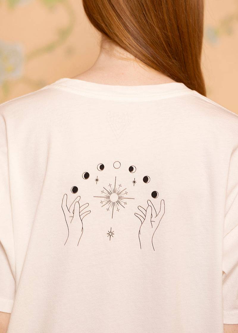 Sacred Light Soundbaths and Crystals Moon T-Shirt featuring detailed images of the different phases of the moon.
