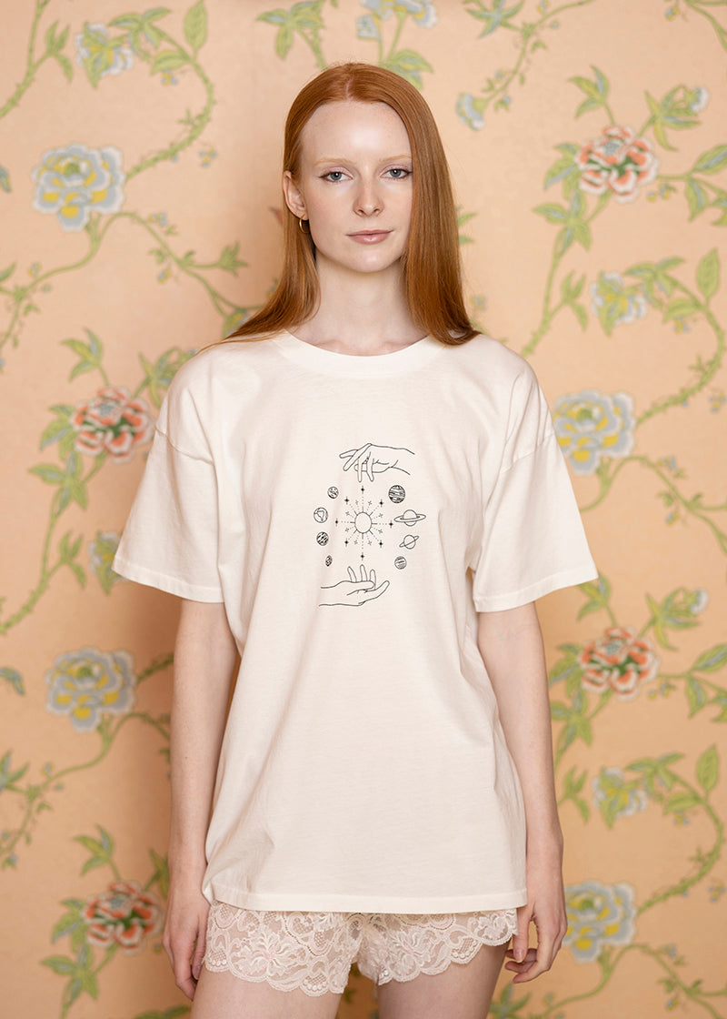 Sacred Light Soundbaths and Crystals Celestial Oversized T-Shirt with celestial print and relaxed fit on model.