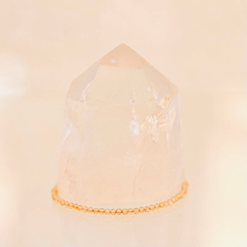 Dainty bracelet featuring Grade AAA Citrine gemstones from Milk and Honey, with small gold chain links.
