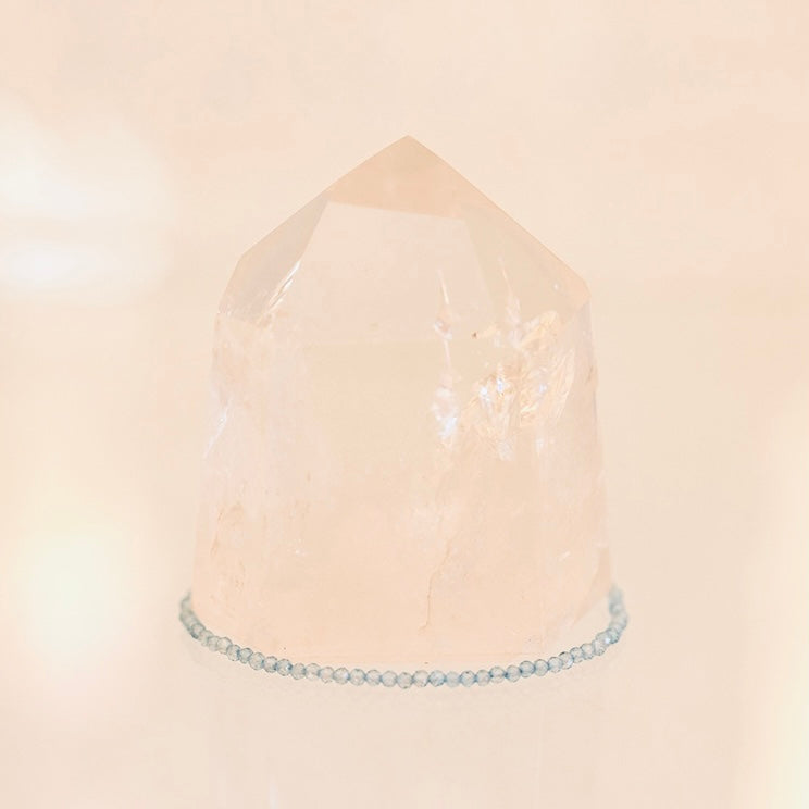 Dainty Grade AAA blue topaz bracelet from Sacred Light Soundbaths and Crystals, featuring sparkling blue gemstones on a delicate chain.