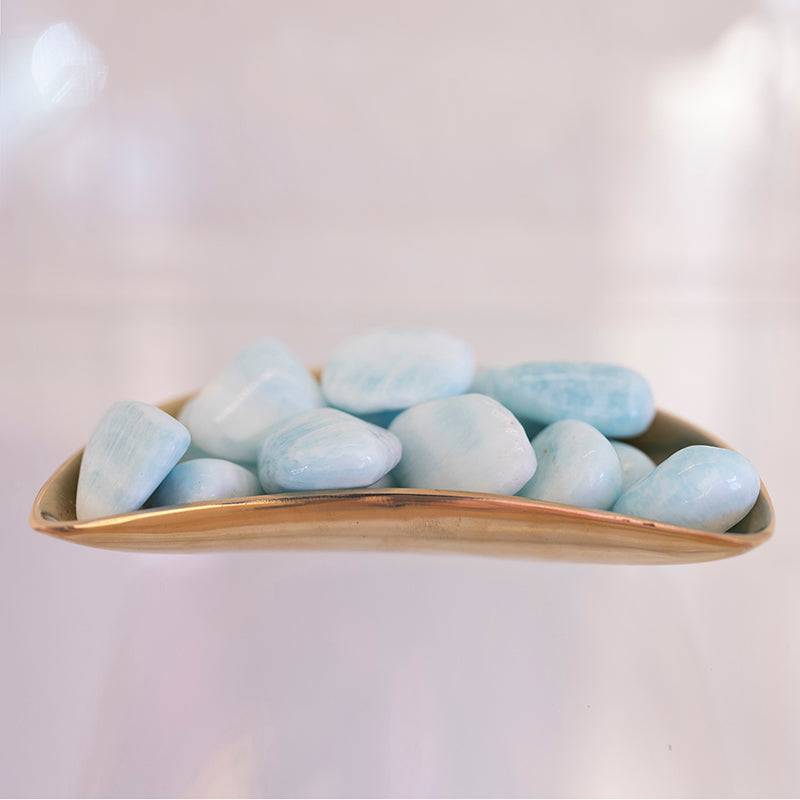 Large tumbled blue Aragonite stone from Sacred Light Soundbaths and Crystals, showcasing smooth, polished blue mineral with natural texture.