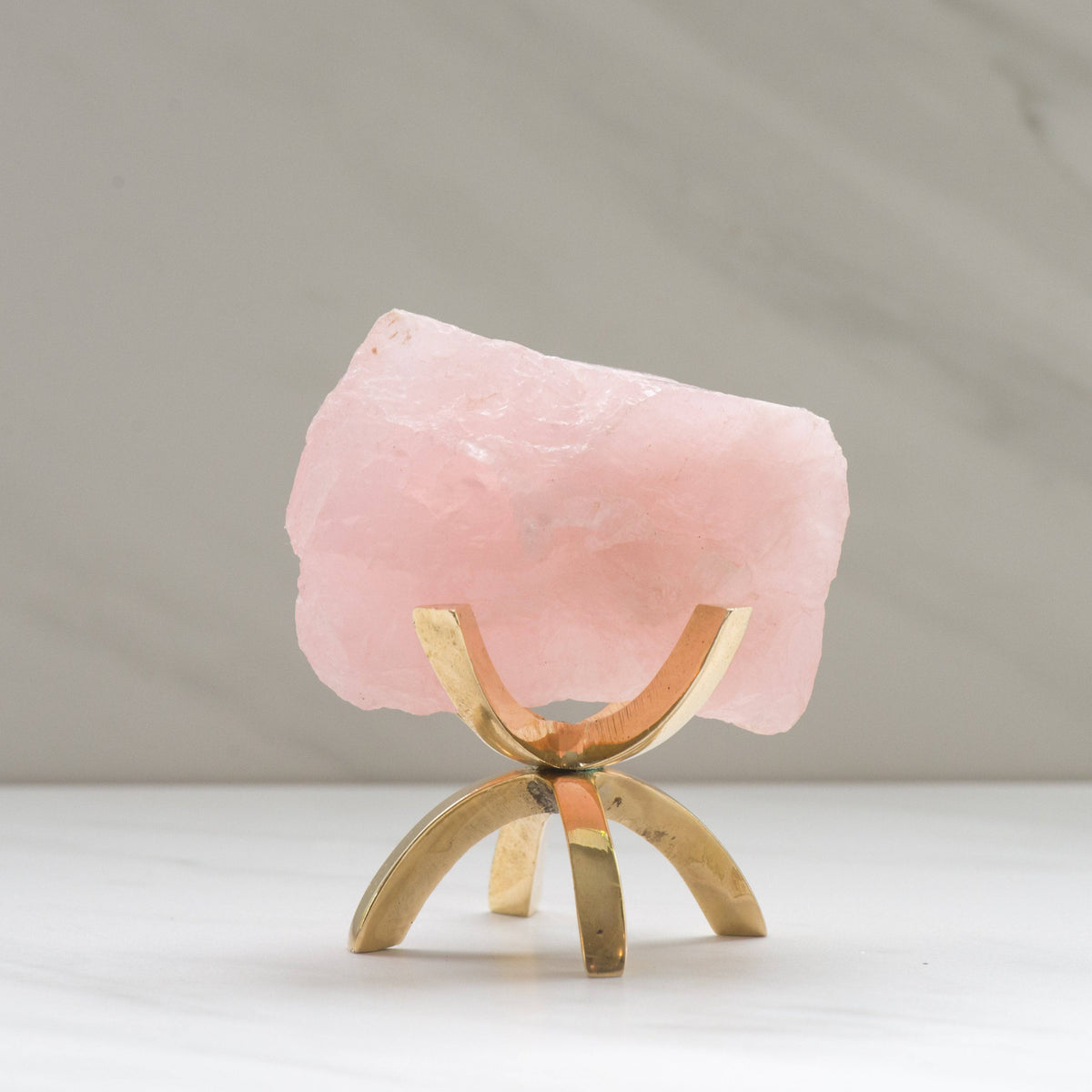 Brass claw crystal stand for specimens, featuring a detailed brass claw holding a crystal, from Sacred Light Soundbaths and Crystals.