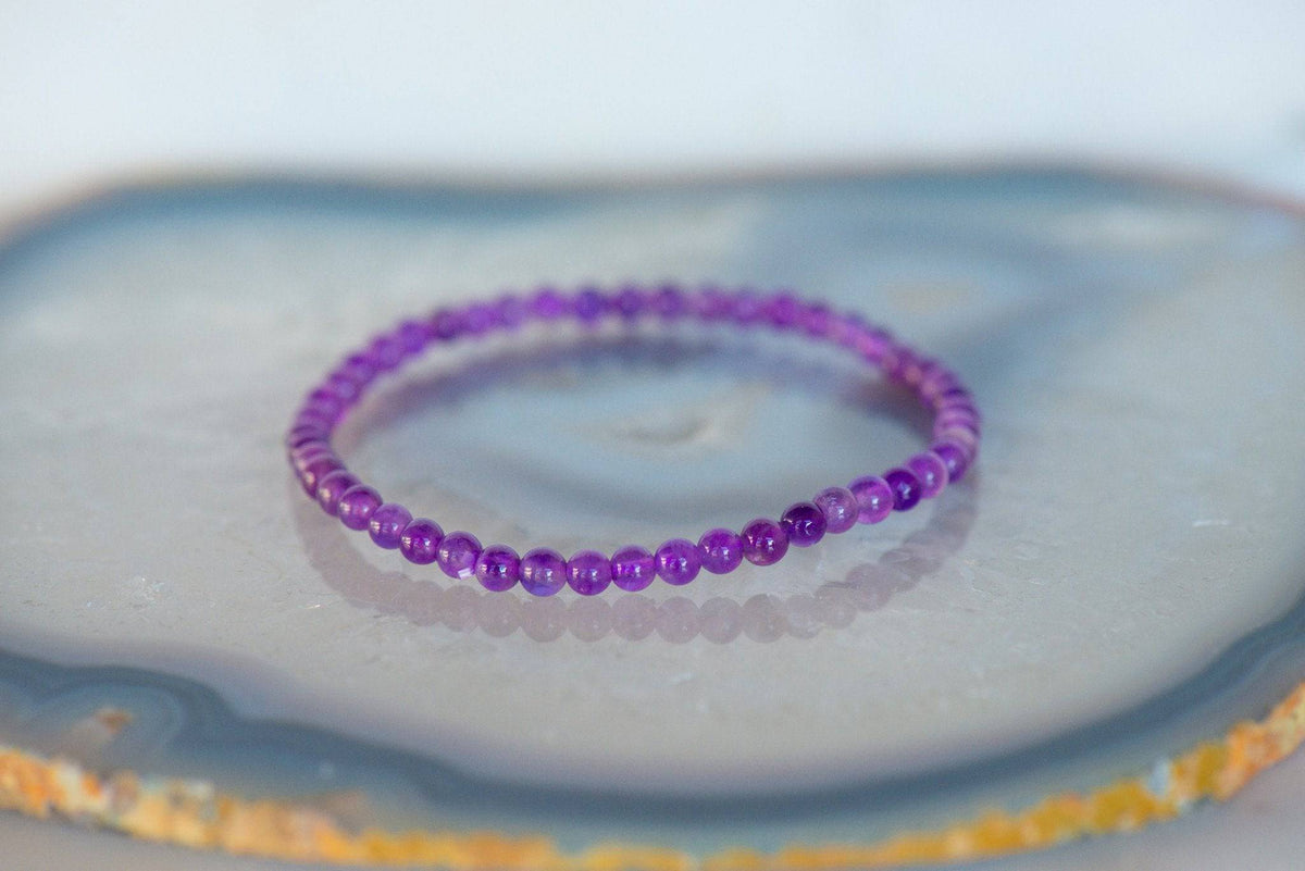 Dainty amethyst bracelet from Milk and Honey jewelry collection with small purple gemstone beads on a delicate chain