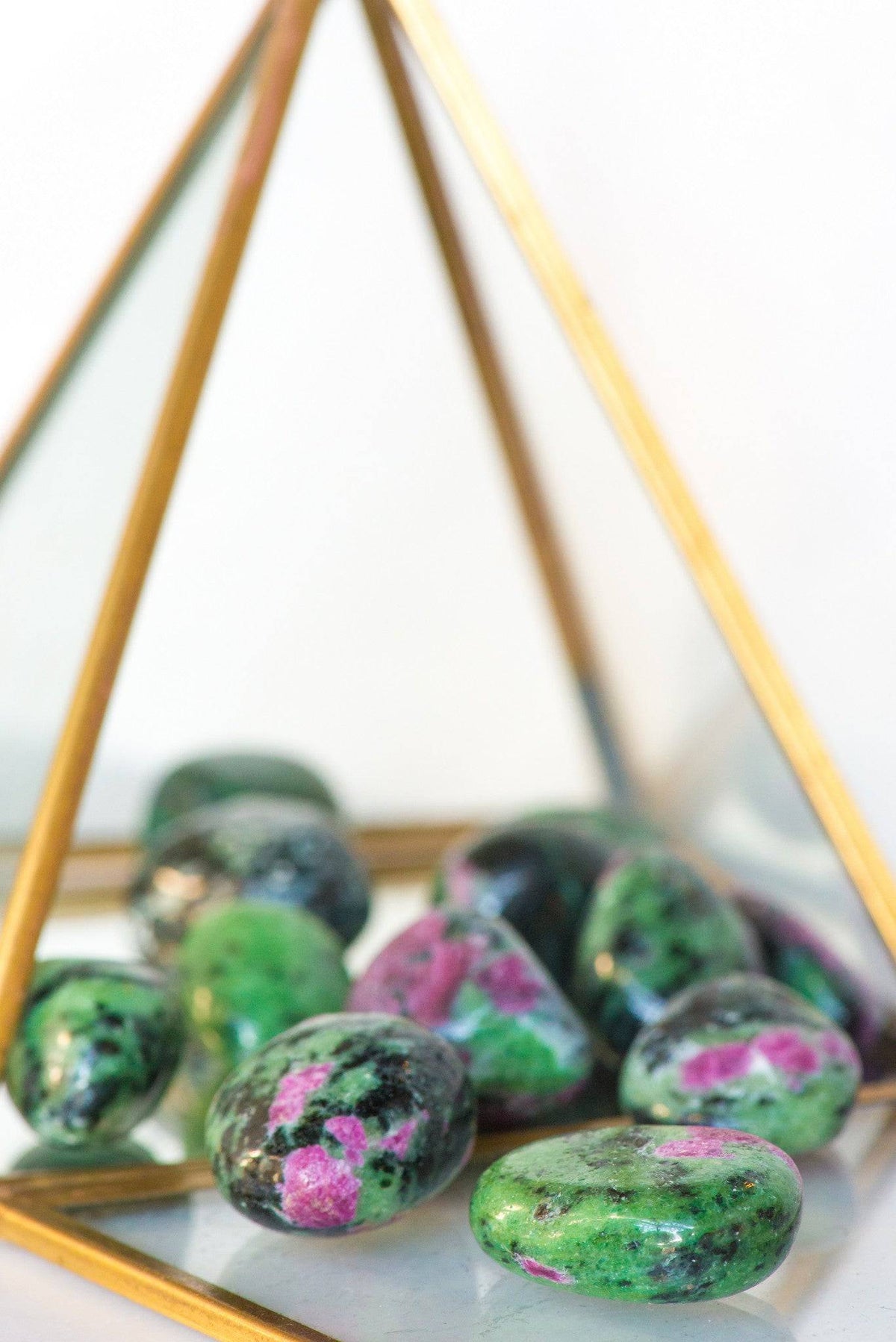 Tumbled Ruby Zoisite stone from Sacred Light Soundbaths and Crystals, showing vibrant green and red mineral hues and smooth polished surface.