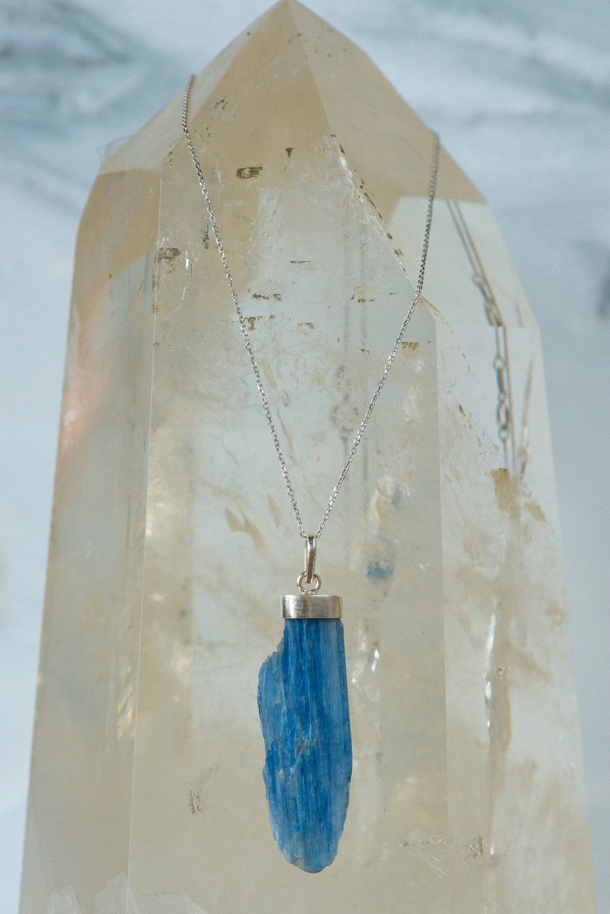 Sterling silver necklace with a striking blue Kyanite pendant, crafted by Sacred Light Soundbaths and Crystals, jewelry accessory