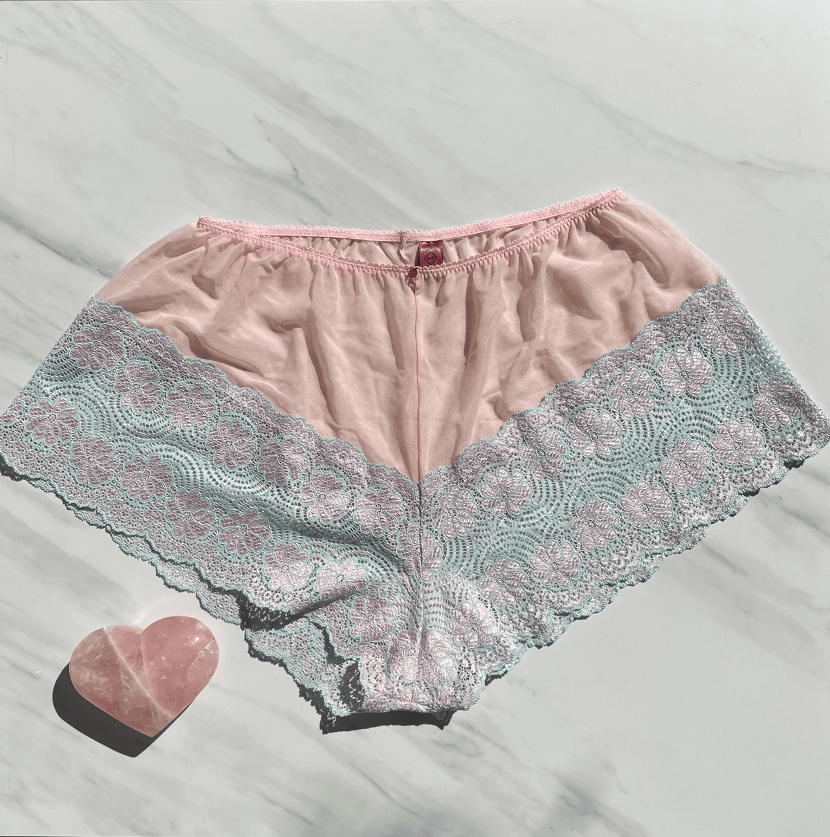 Limited edition Goddess Alice pink Colombian lace underwear with ruby gem embellishments by Sacred Light for a luxurious, elegant look.