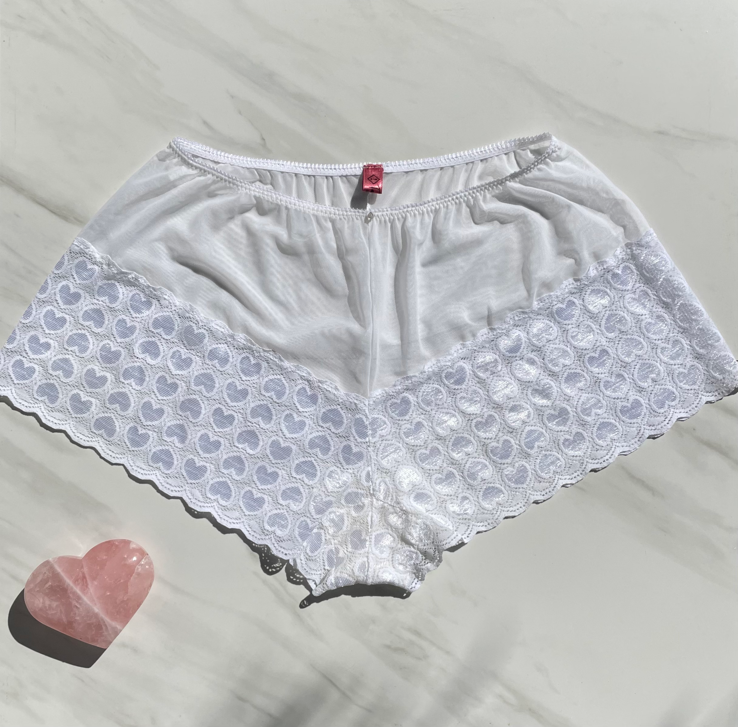 Sacred Light white lace goddess underwear with zircon gem embellishments, featuring heart designs and intricate lace details.