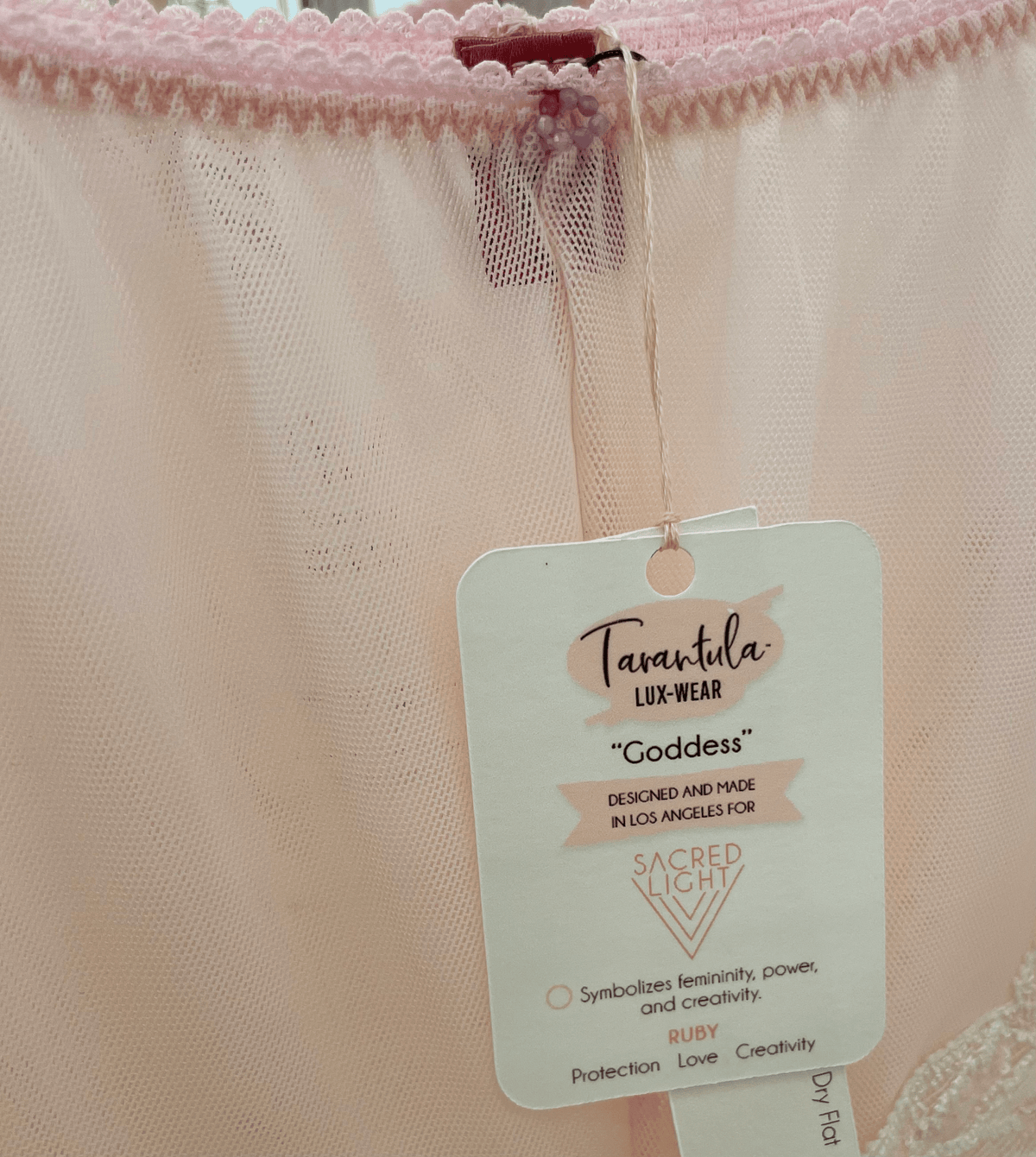 Limited edition Goddess pink French lace underwear with ruby gem embellishments by Sacred Light for a luxurious, sacred light-inspired look.