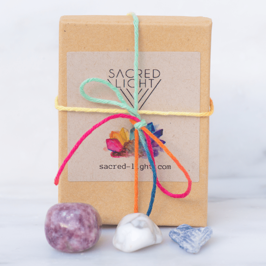 Sacred Light Soundbaths and Crystals anti-anxiety gem stone set with various polished gemstones on a white background.