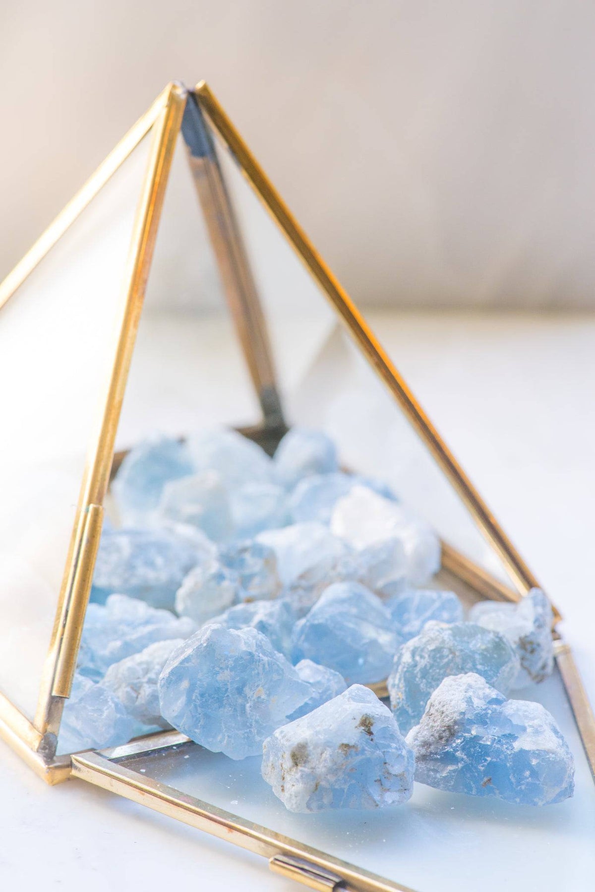 Natural Celestite stone from Sacred Light Soundbaths and Crystals, showcasing its blue crystalline structure and smooth polished surface.