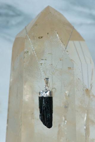 Natural black tourmaline necklace by Sacred Light Soundbaths and Crystals, featuring polished black tourmaline stones on a delicate chain.