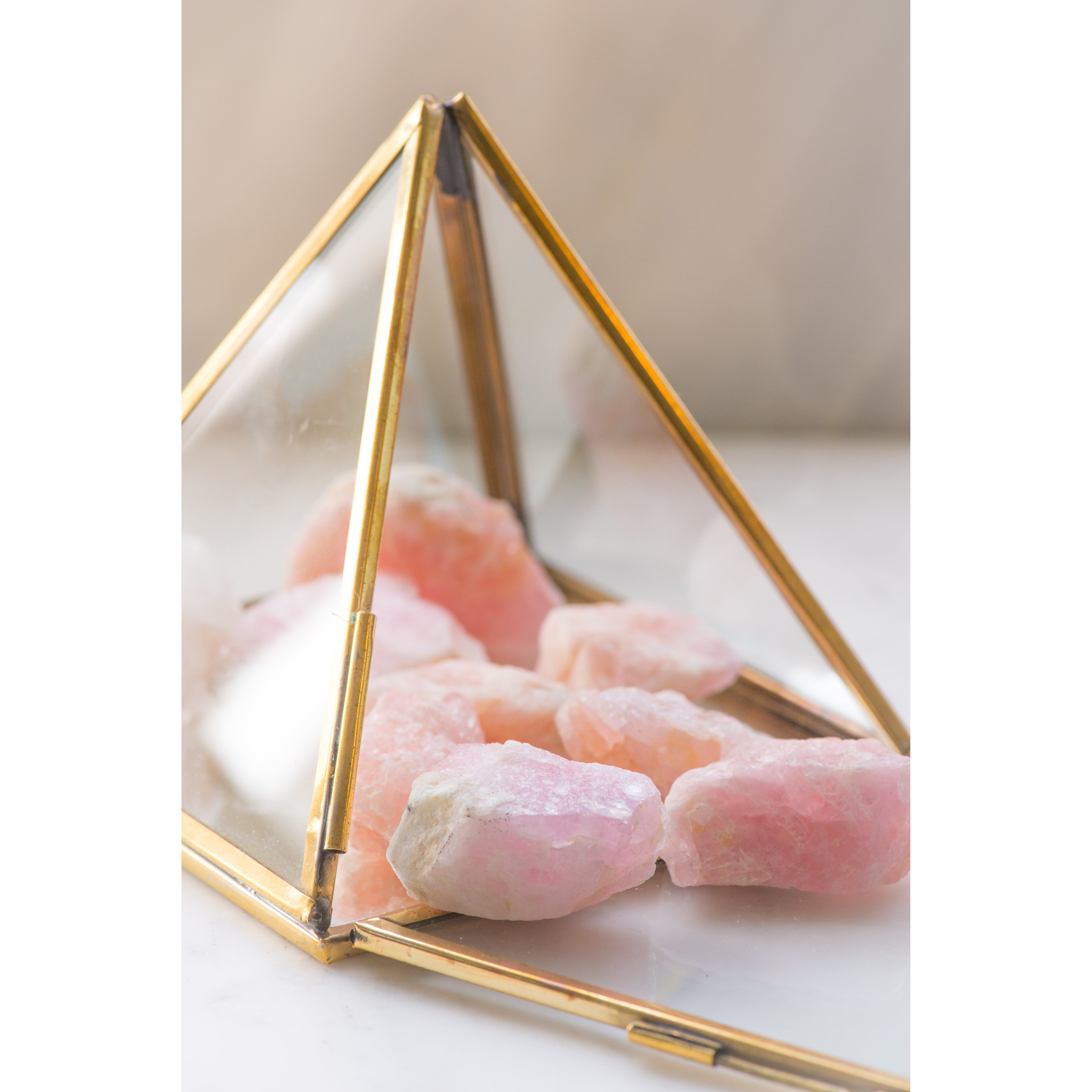 Natural Morganite gemstone from Sacred Light Soundbaths and Crystals, showcasing its soft pink hue and smooth faceted surface.