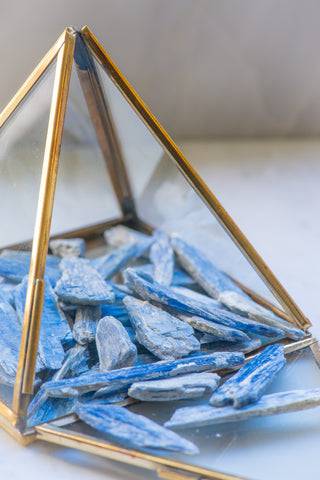 Natural blue Kyanite stone from Sacred Light Soundbaths and Crystals, showcasing its vibrant blue color and crystal structure.