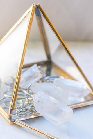 Clear Quartz keychain with a polished crystal pendant attached to a metal chain, designed as a spiritual accessories piece.