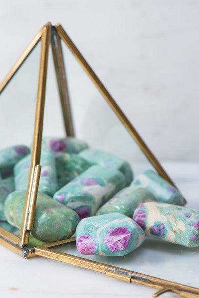 Tumbled Ruby Fuchsite stone from Sacred Light Soundbaths and Crystals, showing vibrant red and green mineral patterns.