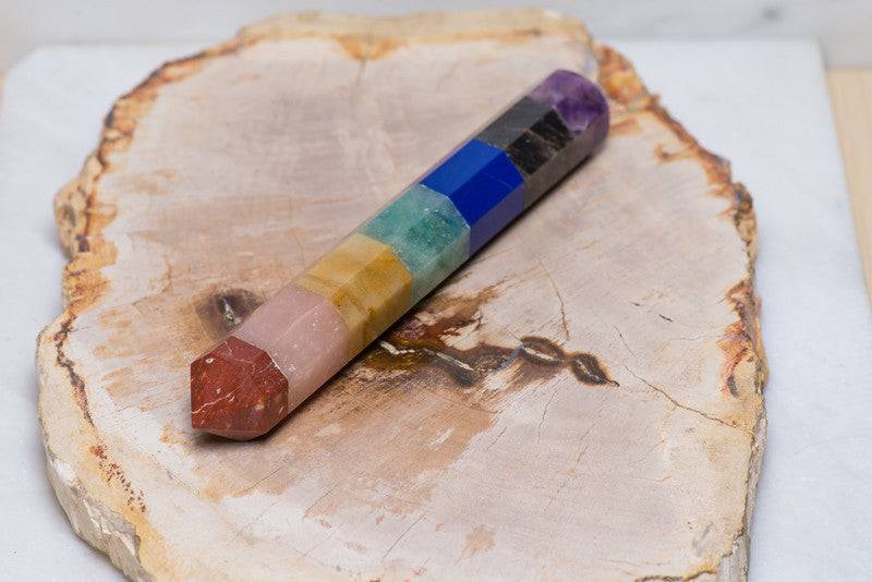 Polished chakra wand from Sacred Light Soundbaths and Crystals, smooth crystal healing wand with vibrant colors and polished finish.