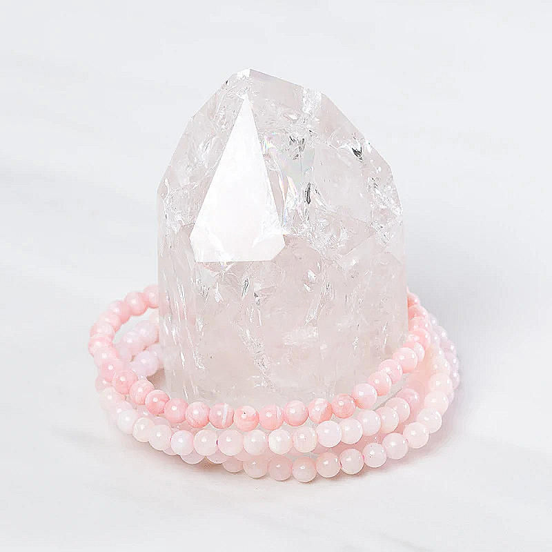 Dainty pink opal bracelet from Milk and Honey featuring smooth pink opal beads on a delicate jewelry chain.