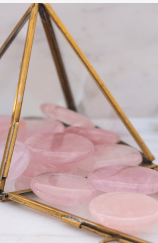 Small rose quartz palm stone by Sacred Light Soundbaths and Crystals, polished pink crystal for meditation and healing.