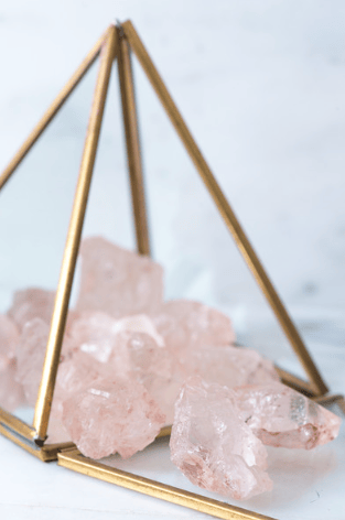 Pink Himalayan Nirvana Quartz crystal from Sacred Light Soundbaths and Crystals, showcasing its pink hue and unique natural formations.