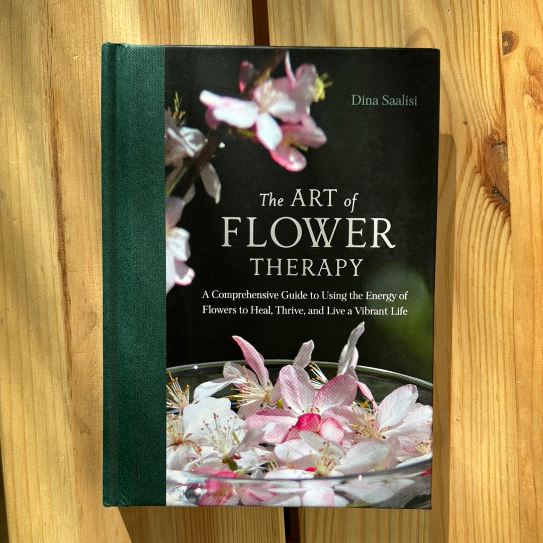 Image of a book titled "The Art of Flower Therapy" by Sacred Light Soundbaths and Crystals, featuring floral illustrations on the cover.