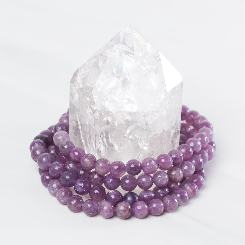 Medium Lepidolite bracelet by Milk and Honey featuring smooth purple stones on a delicate jewelry band.