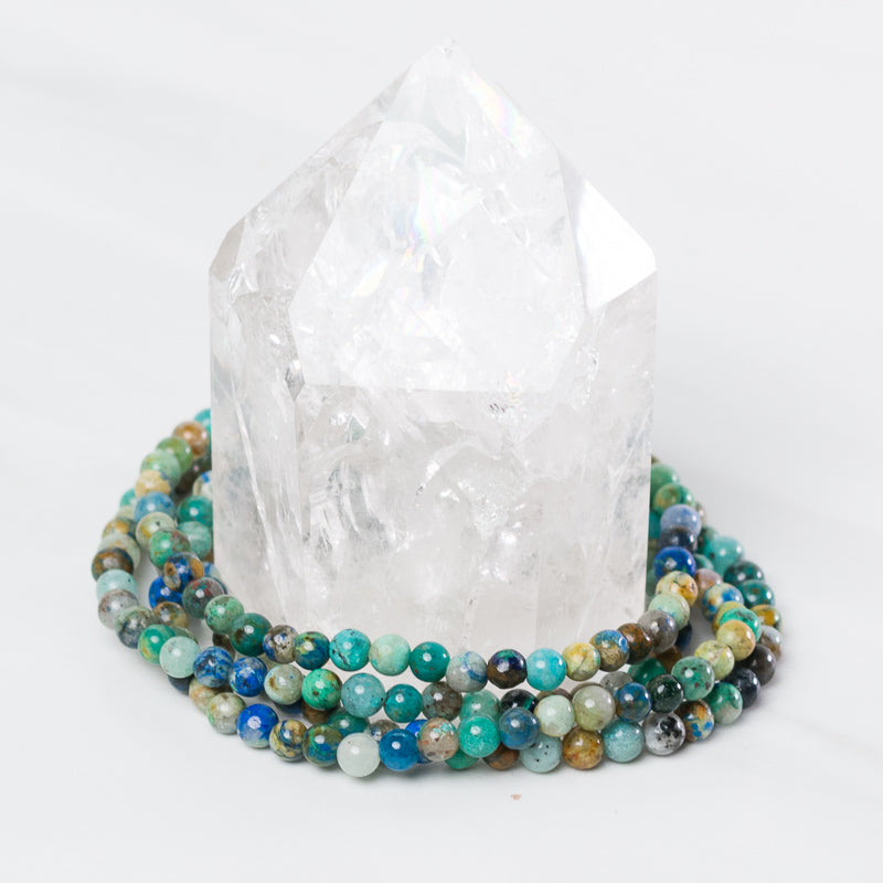 Chrysocolla bracelet by Milk and Honey featuring vibrant blue-green gemstones on a delicate jewelry band.