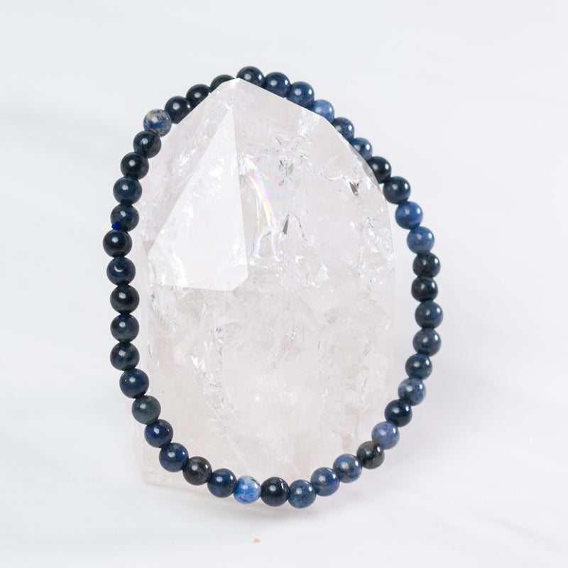 Dumortierite dainty bracelet by Milk and Honey featuring small blue gemstone beads and a delicate silver clasp.