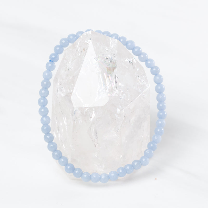 Delicate Angelite bracelet by Milk and Honey featuring smooth, light blue gemstone beads on a fine jewelry chain.