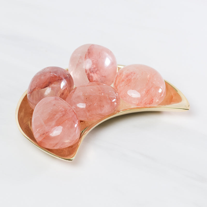 Hematoid Quartz stones from Sacred Light Soundbaths and Crystals, showcasing deep red and clear crystal clusters.