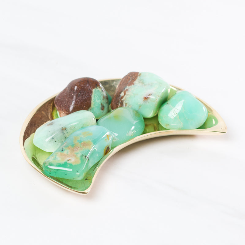 Tumbled green chrysoprase stone from Sacred Light Soundbaths and Crystals, showcasing smooth, polished green gemstone with vibrant color.