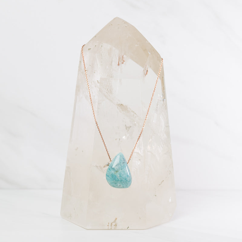 Amazonite teardrop necklace featuring a polished blue-green gemstone pendant on a delicate chain, jewelry by Sacred Light Soundbaths and Crystals.