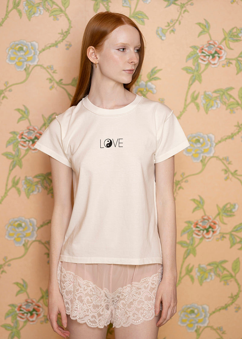 Sacred Light Soundbaths and Crystals Love Yin Yang T-Shirt featuring a black and white yin yang design on the front.