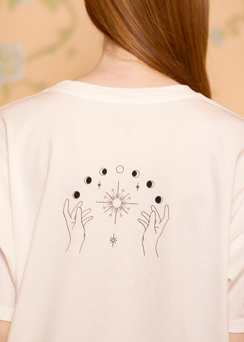 Sacred Light Soundbaths and Crystals Phases of the Moon T-shirt featuring a detailed graphic of moon phases on soft fabric