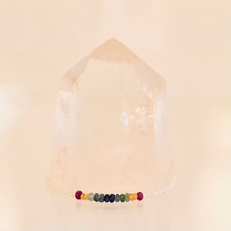 Dainty bracelet featuring Grade AAA white topaz and multi-faceted sapphires, crafted by Milk and Honey jewelry brand.