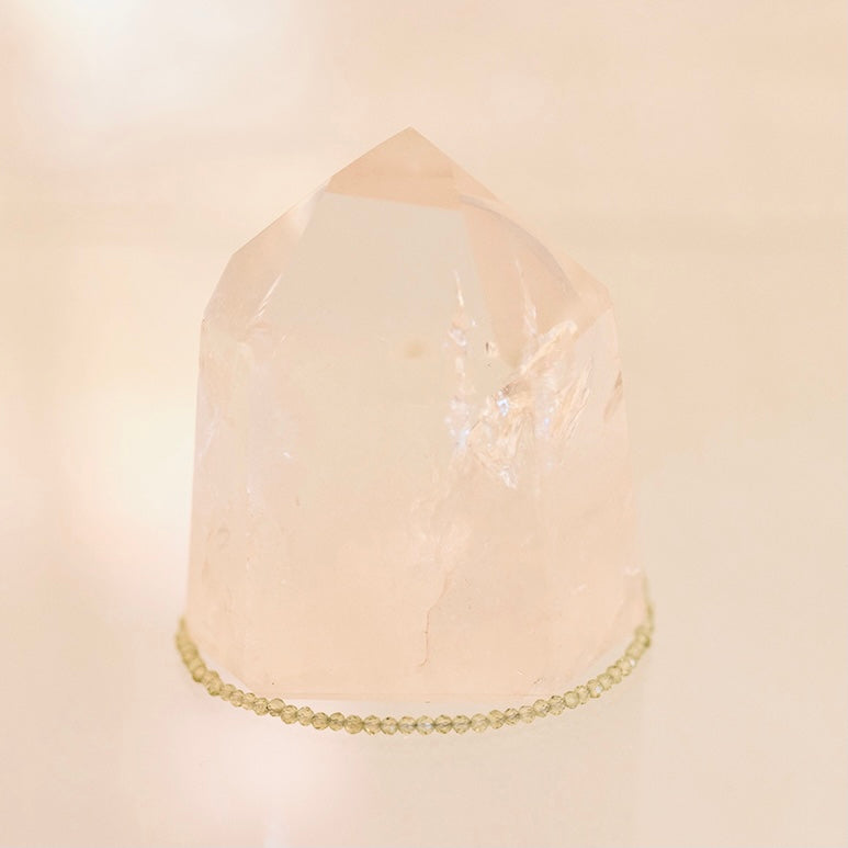 Dainty Grade AAA Prehnite bracelet by Milk and Honey featuring smooth, polished green gemstone beads on a delicate jewelry chain.