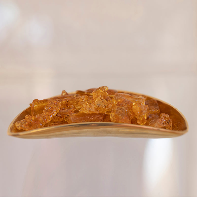 Polished Colombian Amber stone from Sacred Light Soundbaths and Crystals, showcasing warm amber hues and natural crystalline textures.